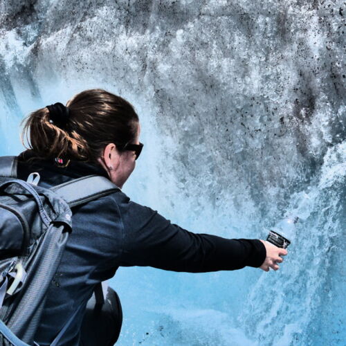 Photos of Canada, Claire collecting water from the melting glacier