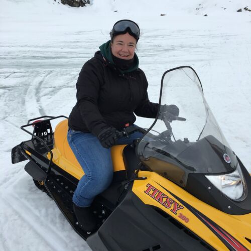 Snowmobiling in Romania Claire on a snowmobile on a small group tour of Romania