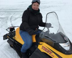 Snowmobiling in Romania Claire on a snowmobile on a small group tour of Romania