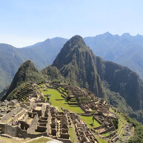 Photos of Peru, Machu Pichu, lush green forest background with mountains and Inca ruins