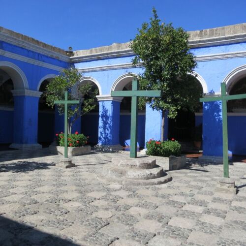 Photos of Peru, Three crosses in a courtyard surrounded by deep blue walls in the Santa Catalina Monastery