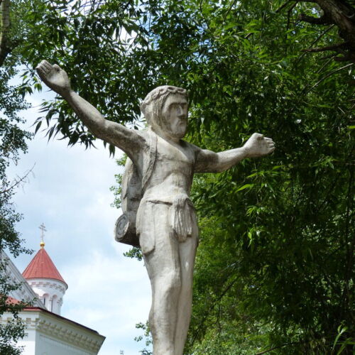 Backpacking Jesus A statue of Jesus with a rucksack and sleeping bag