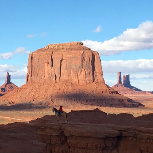 A man on horseback in Monument valley