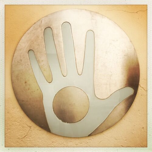 Užupis logo A hand with a hole in the palm