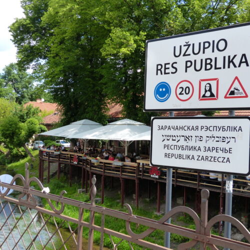 Užupis sign A welcome sign to Užupis with a smiley face, speed limit and a symbol of the Mona Lisa