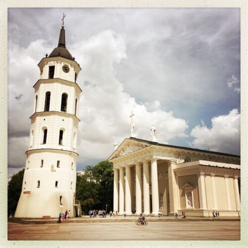 Vilnius Cathedral outside of Vilnius cathedral, a white columned building with a separate bell tower.